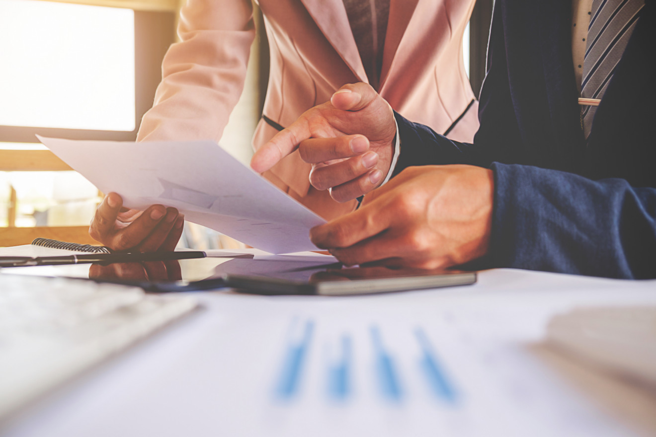 Business concept. Business people discussing the charts and graphs showing the results of their successful teamwork. Selective focus. Business concept. Business people discussing the charts and graphs showing the results of their successful teamwork. Selective focus.