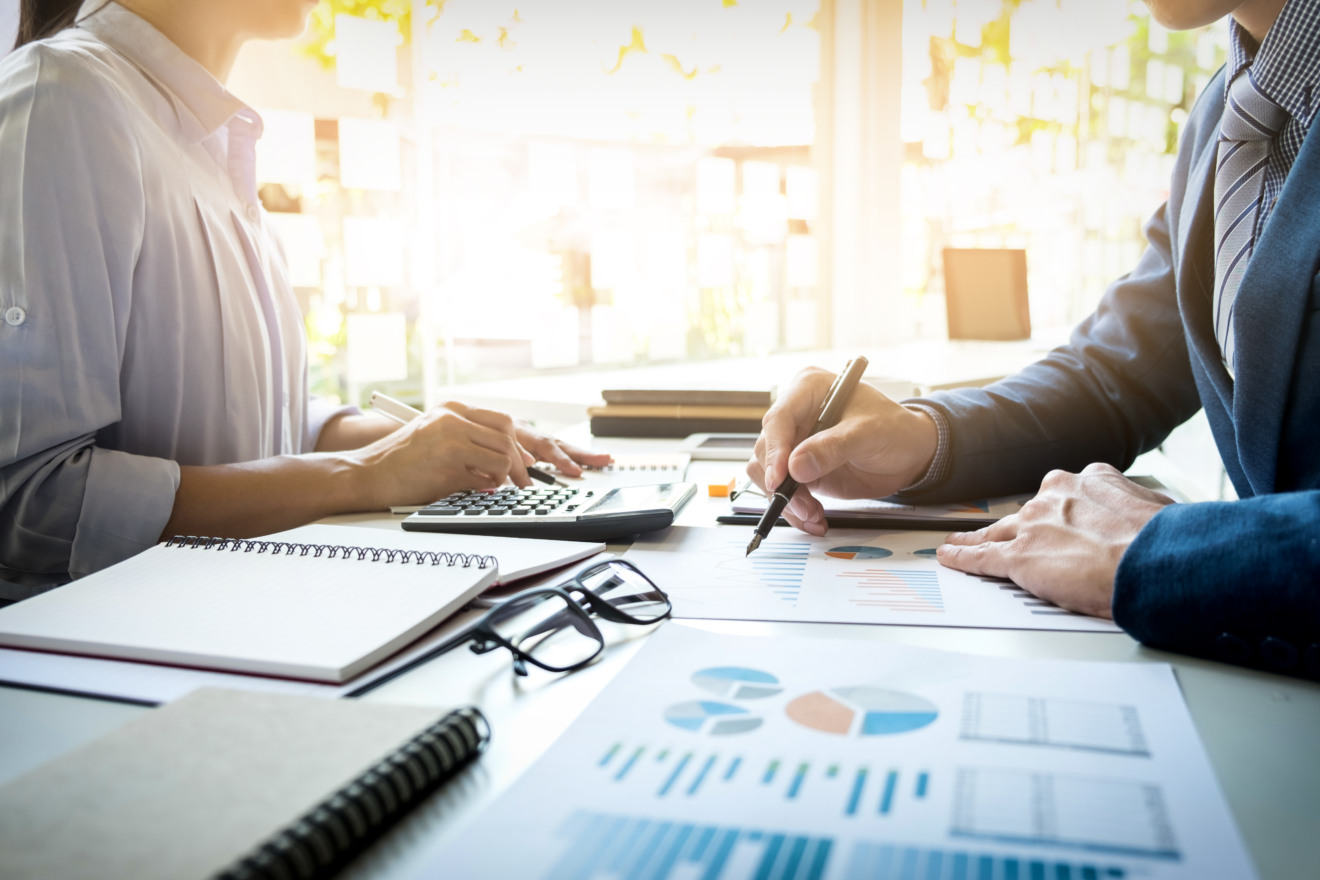 business man financial inspector and secretary making report, calculating or checking balance. Internal Revenue Service inspector checking document. Audit concept business man financial inspector and secretary making report, calculating or checking balance. Internal Revenue Service inspector checking document. Audit concept