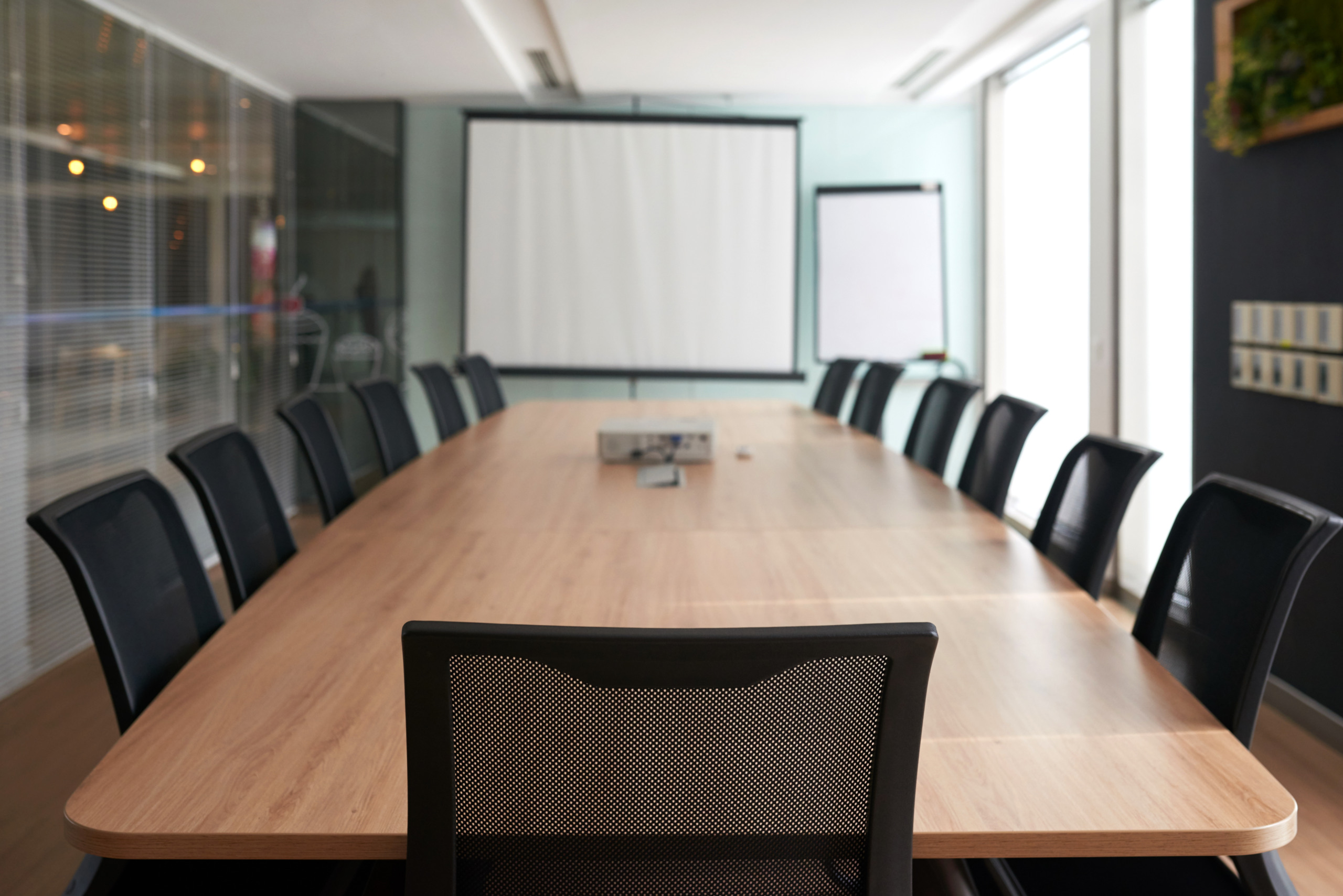 Empty meeting room, focus on chair of chef